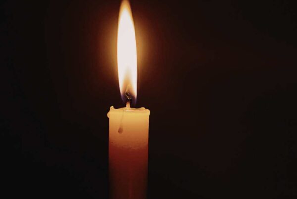 the flame of a candle indicating the fire of God's love